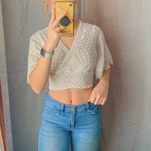 This is a pure white, cropped, t-shirt.